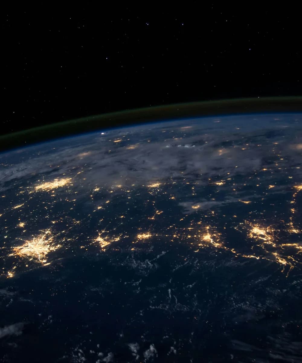 Earth at night from space — Multi Biz Solutions serves clients worldwide